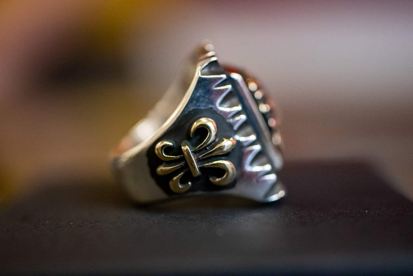 Handmade from sterling silver and brass in South Korea, this ring features a raised Native American Chief head motif